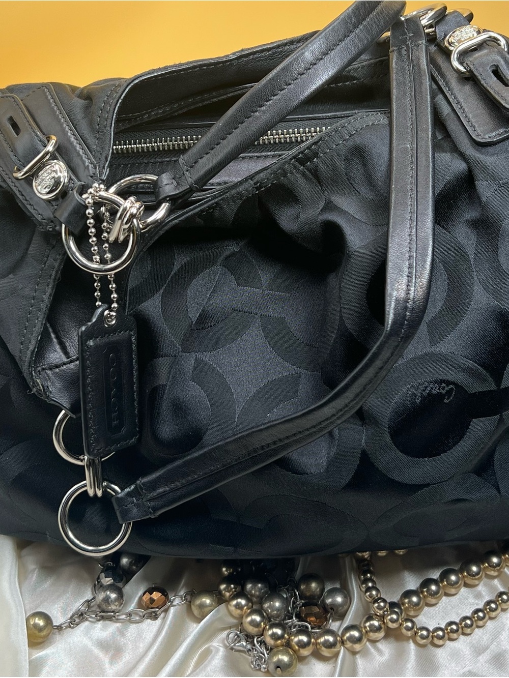 COACH Madison Large Black Coach Pattern Shoulder Bag.